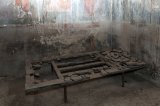 Remains of a bed in the House of the Wooden Partition, Herculaneum