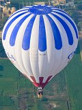 Hot Air Balloon over Green Fields